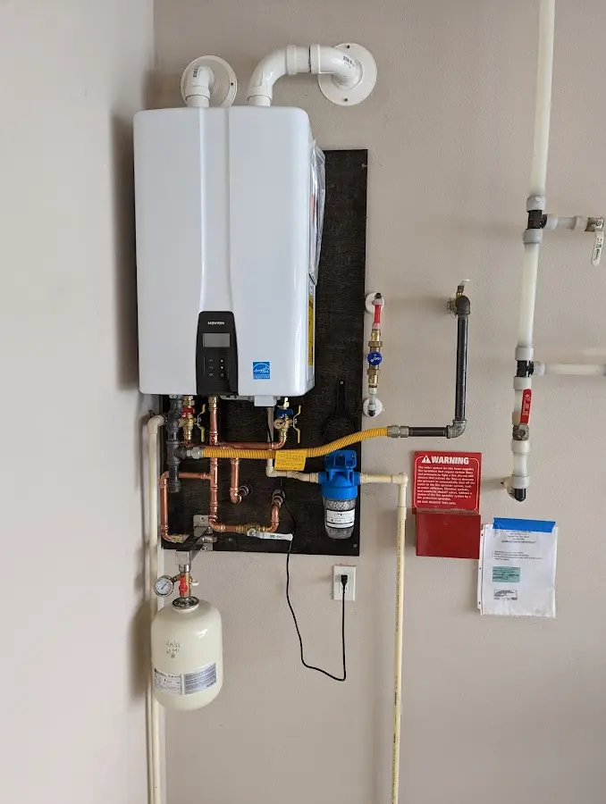 Professional plumber installing copper piping in a Honea Path home
